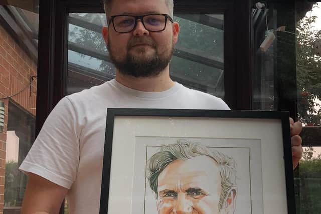 Lucky winner Daniel Hollis with his Don Revie print.