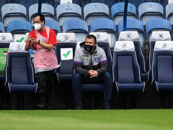 Chris Chester, right, at John Smith's Stadium. Picture by Jonathan Gawthorpe.
