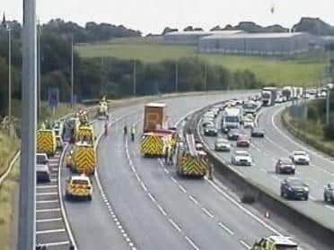 Appeal after man and woman seriously injured in HGV and Audi crash on ...