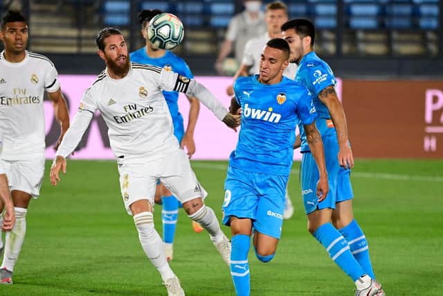 BIG TIME - Leeds United transfer target Rodrigo in action for Valencia against Real Madrid and Sergio Ramos. Pic: Getty
