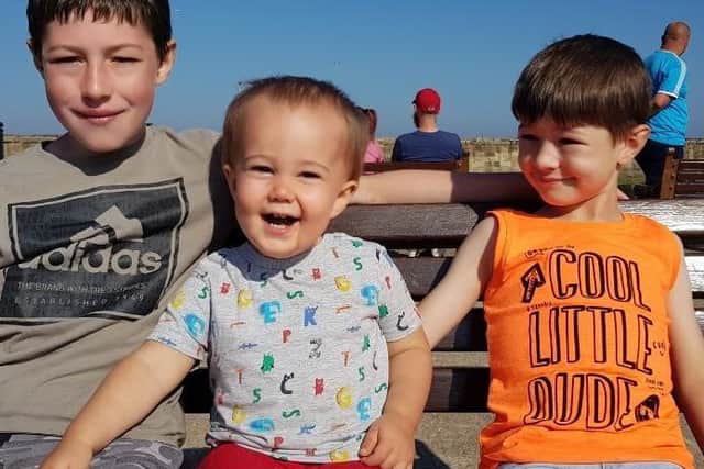 Kasper with his brothers, 13-year-old Ryan and Ashton, seven, who cannot visit him in hospital