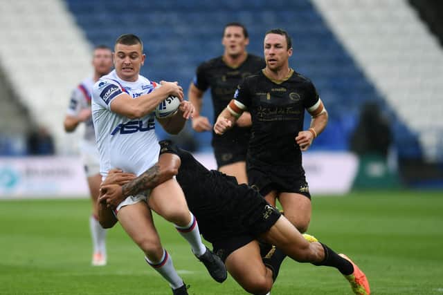 Wakefield's Jordan Crowther is tackled during last week's game against Catalans. Picture by Jonathan Gawthorpe.