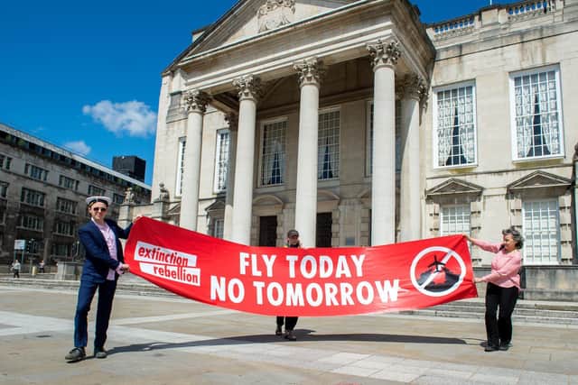 Christopher Hore, Alstair Chestermn and Drew Long of Extinction Rebellion hold socially distanced protest against expansion of Leeds Bradford Airport outside Leeds Civic Hall.
21 May 2020. Picture: Bruce Rollinson
