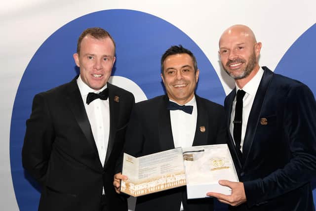 IMPRESSED: Former Leeds United defender Danny Mills, right, with chairman Andrea Radrizzani, centre, and chief executive Angus Kinnear celebrating the club's centenary last October. Picture by Jonathan Gawthorpe.
