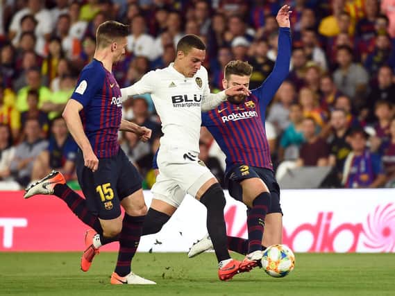 NEW BOY - Rodrigo, pictured here in action for Valencia against Barcelona, is Leeds United's record transfer signing. Pic: Getty