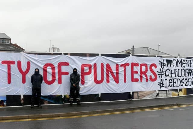 Members of Leeds ReSisters in front of the banner (photo: Gary Longbottom).