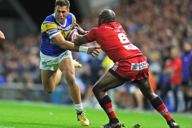 Rob Lui, playing for Salford, tackles Rhinos' Joel Moon during the 2018 middle-eights at Headingley. Picture by Tony Johnson.