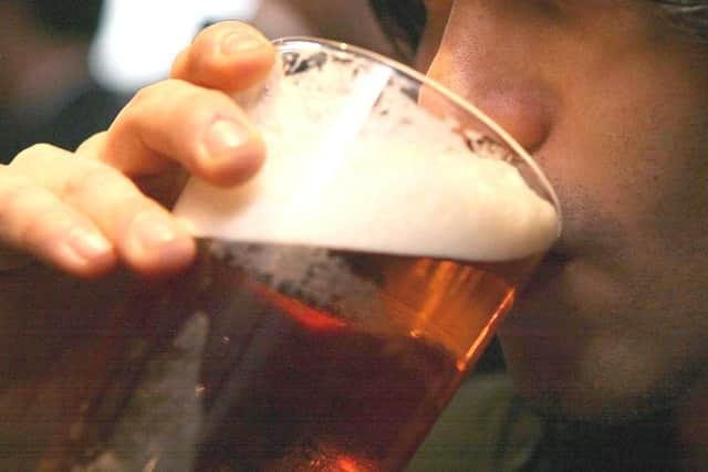 A drinker enjoys a pint (photo: Johnny Green / PA Wire).