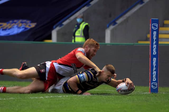 Leeds Rhinos' Ash Handley scores his second try against Salford. Picture: Mike Egerton/PA Wire.