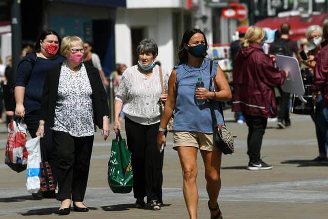 Shoppers venture out and return to Briggate in Leeds city centre.