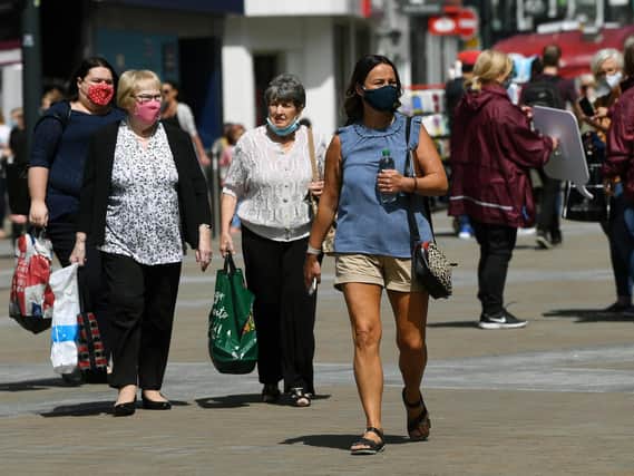 Shoppers venture out and return to Briggate in Leeds city centre.