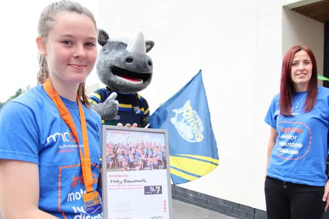 Holly Beaumont at Emerald Headingley after completing her summer long fundraising effort with Ronnie the Rhino and MNDA Regional Fundraiser Jenn Dodd