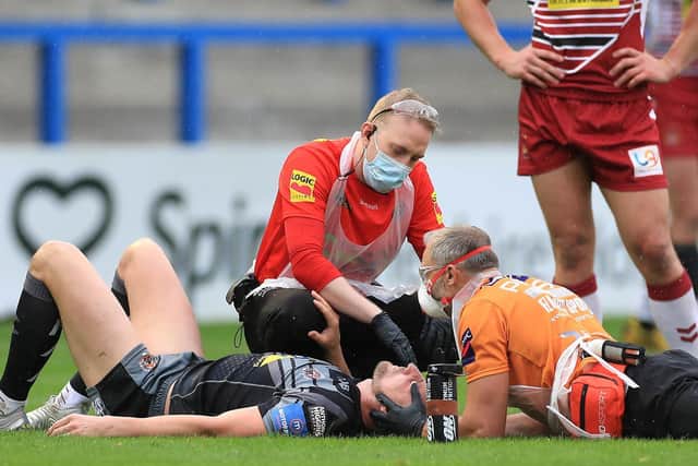 Medical staff attend to James Clare during Tigers' loss to Wigan. Picture by Mike Egerton/PA Wire.