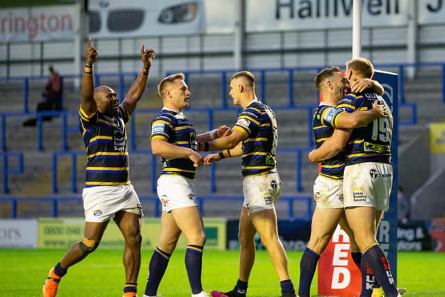 Mikolaj Oledzki celebrates with Luke Gale and team-mates after scoring against Salford. Picture: Isabel Pearce/SWpix.com.