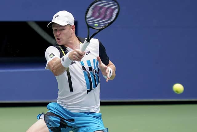 Kyle Edmund, of Great Britain, returns a shot to Novak Djokovic at the US Open. (AP Photo/Seth Wenig)
