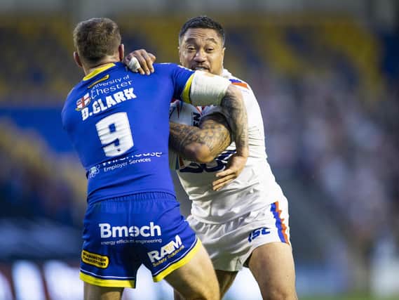 Wakefield's Tinirau Arona is tackled by Daryl Clark, of  Warrington, during last weekend's game. Picture by  Isabel Pearce/SWpix.com.