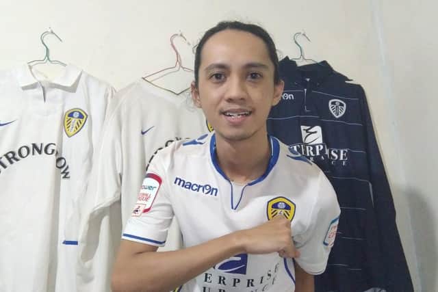 Teguh Sutasman poses with his Leeds United shirts.