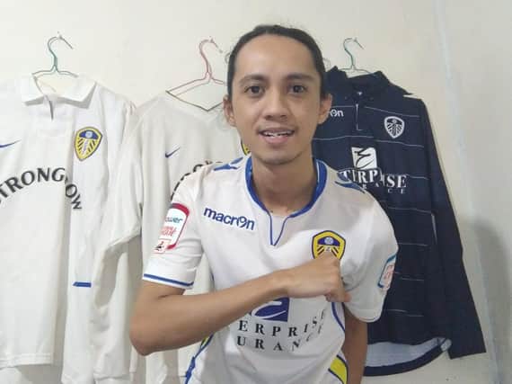 Teguh Sutasman poses with his Leeds United shirts.
