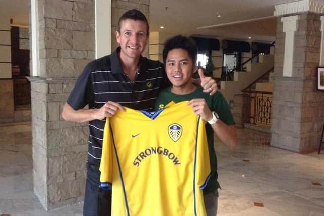 Leeds United Indonesia supporters club member Genta Pradipta with Michael Bridges.