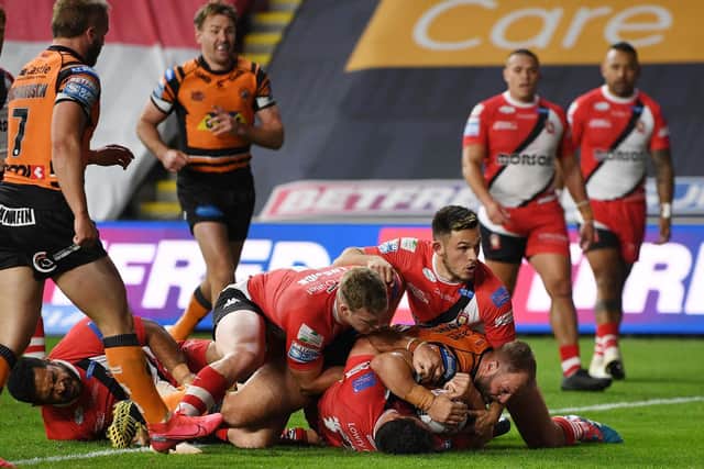 Paul McShane touches down for Tigers' third try. Picture by Jonathan Gawthorpe.