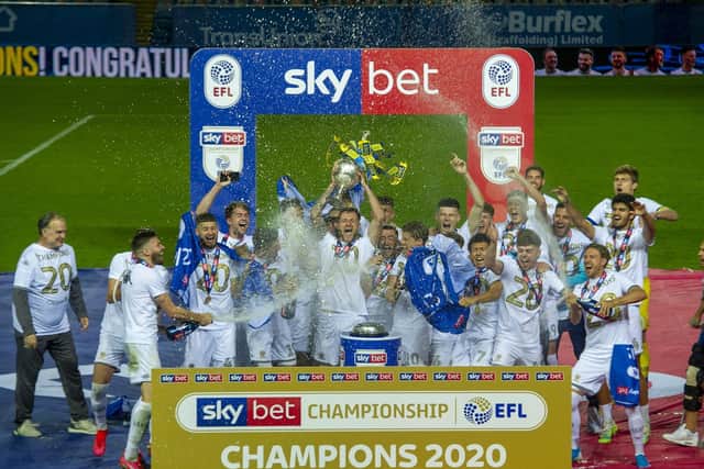 SPECIAL MEMORY - Liam Cooper lifting the Championship trophy as Leeds United captain in their centenary season