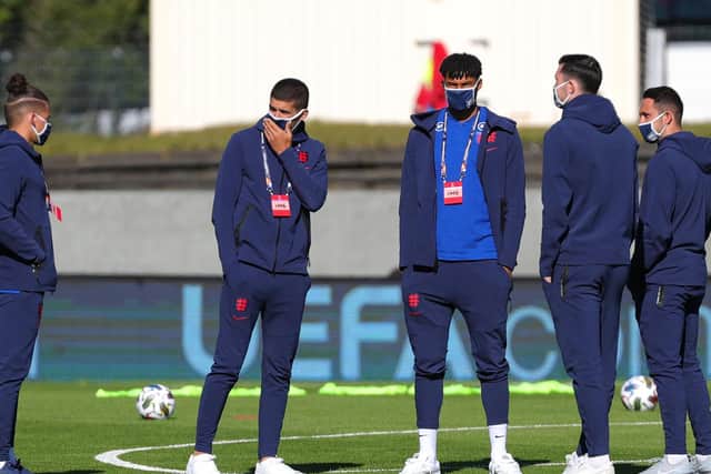 COUNTRY CALLS: Leeds United midfielder Kalvin Phillips, left, with Conor Coady, Tyrone Mings, Michael Keane and Danny Ings as England take a look at the pitch prior to the UEFA Nations League clash at Iceland. Photo by Haflidi Breidfjord/Getty Images)