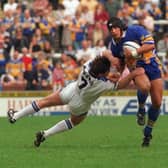 Nathan Picchi goes past Mark Aston on his debut for Leeds against Sheffield Eagles at Headingley. Picture: Steve Riding.