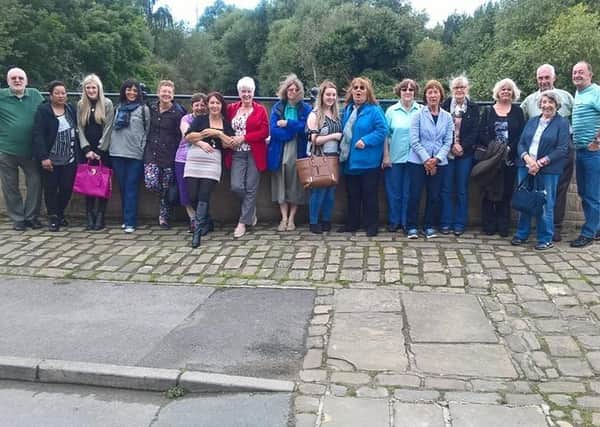 Armley Helping Hands’ board of trustees, staff and volunteers are pictured taking a break from their busy routine on an away day.