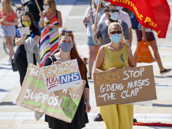 NHS workers demonstrate in Millennium Square, Leeds on Saturday August 8 as part of a national protest over pay. 

Photo:  Danny Lawson/PA Wire