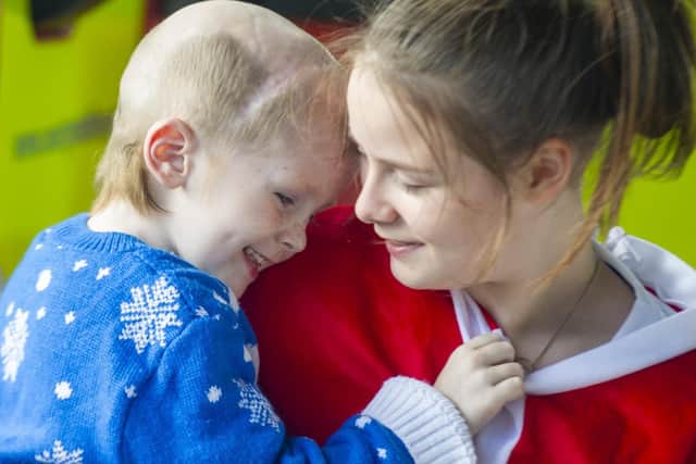 Early Xmas day celebrations for three-year-old Ellis Price from Horbury who has terminal brain cancer.
Ellis pictured  with his sister Caitlin. 
Picture Tony Johnson