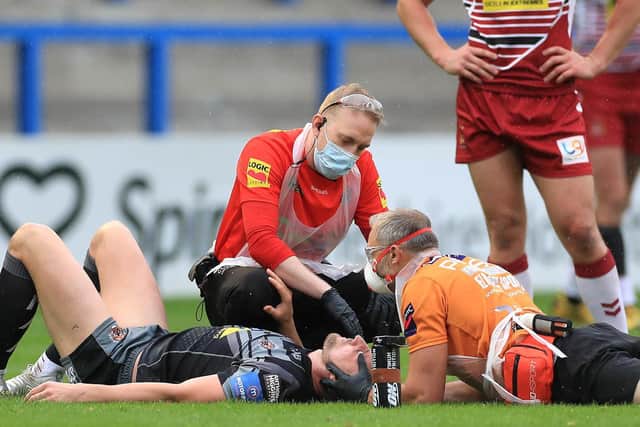 James Clare is treated during Tigers' defeat by Wigan. Picture by Mike Egerton/PA Wire.