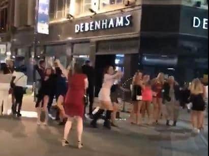 A large group partying on Briggate in Leeds city centre (video: Josh Sedman).