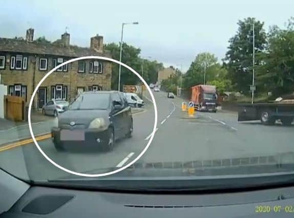 The moment a driver overtook two HGVs on a road in Keighley, caught on a witness's dash cam. Image: West Yorkshire Police