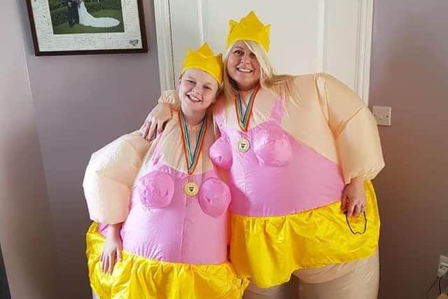 Liz Ellwood wiith son Dalton, in their ballerina suits