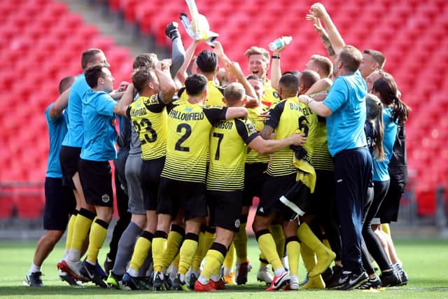 Harrogate Town players and staff celebrate after the final whistle of the National League play-off final at Wembley. Picture: Adam Davy/PA
