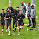 'PROMISING': Liverpool boss Jurgen Klopp, top, looks on as his Reds are put through their paces at Melwood this week with captain Jordan Henderson, right, back in full training. Photo by Andrew Powell/Liverpool FC via Getty Images.