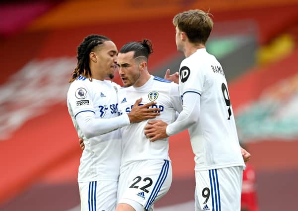GOOD START: Leeds United's Jack Harrison celebrates scoring his side's first goal of the game with team-mates Helder Costa, left, and Patrick Bamford, right, at Anfield. Picture: Shaun Botterill/NMC Pool/PA
