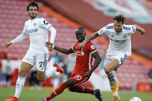 NEW DEFENCE: Leeds United centre-back duo Robin Koch, right, and Pascal Struijk, left, look to keep out Liverpool livewire Sadio Mane. Photo by Phil Noble - Pool/Getty Images.