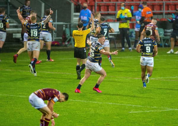 TIMELY: Leeds Rhinos' players celebrate their Super League win over Huddersfield Giants on Friday night. Picture: Bruce Rollinson