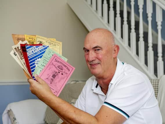 Mick Hewitt with away match programmes from 1931. PIC: Tony Johnson