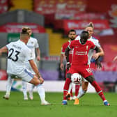 ENERGETIC: Leeds United hunt down Liverpool forward Sadio Mane during Saturday's clash at Anfield with Kalvin Phillps, Luke Ayling and Jack Harrison all in close attendance. Photo by Paul Ellis - Pool/Getty Images.