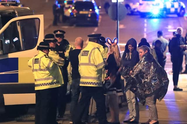 Police at the scene following the blast at Manchester Arena