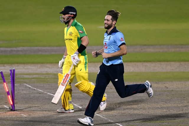England's Chris Woakes celebrates taking the wicket of Australia's Aaron Finch during the second Royal London ODI match at Emirates Old Trafford Picture: : Shaun Botterill/NMC Pool/PA