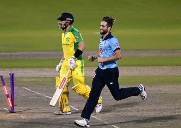 England's Chris Woakes celebrates taking the wicket of Australia's Aaron Finch during the second Royal London ODI match at Emirates Old Trafford Picture: : Shaun Botterill/NMC Pool/PA
