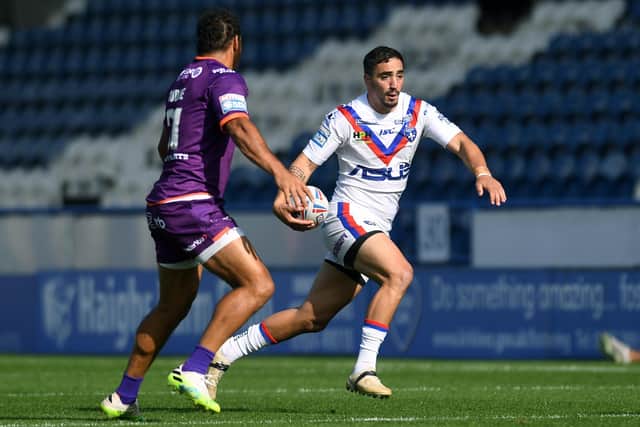 Huddersfield's Leroy Cudjoe shapes up to shut out Wakefield's Tony Gigot.
Picture: Jonathan Gawthorpe/JPIMedia.