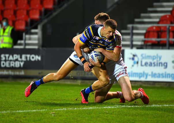 Can't stop him: 
Rhinos' Ash Handley scores the second try of the game.
Picture: Jonathan Gawthorpe