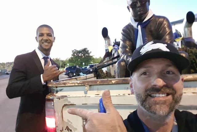 Tony Clark and Jermaine Beckford, who signed the truck used to parade the bronzed Bielsa around Leeds
