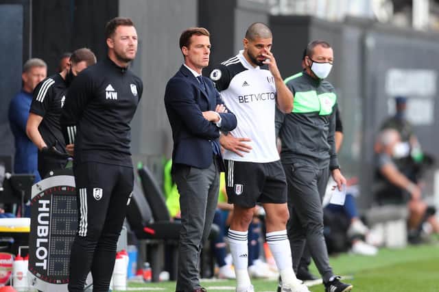 CENTRAL FIGURE: Fulham boss Scott Parker brings on Aleksandar Mitrovic in the 3-0 loss at home to Arsenal with the striker having had just two Cottagers training sessions after international duty. Photo by Clive Rose/Getty Images.