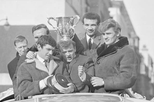 BREAKTHROUGH TRIUMPH: Leeds United captain Billy Bremner wears the League Cup trophy on his head as the Whites celebrate a ground-breaking success at a civic reception and bus parade in March 1968. Picture by Varleys.