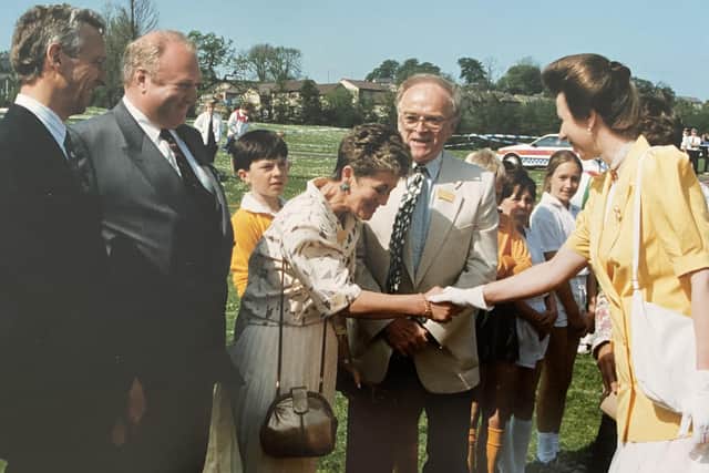 Princess Anne greeting Brian Hazell and his wife Lynne at a presentation to Save The Children.